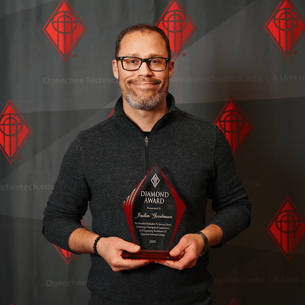 Justin Goodman holds Ogeechee Technical College's 2023 Diamond Award.